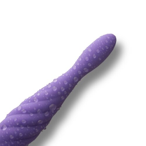 Purple vibrator with a textured surface, covered in droplets