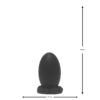 A black egg-shaped object on a textured base
