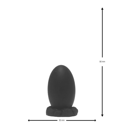 A black egg-shaped object on a textured base