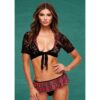 This chic summer outfit combines playful plaid with elegant lace. Model in a black lace top and plaid bikini