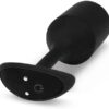 Black device with a curved design and buttons