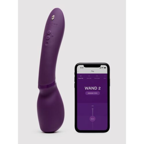 We-Vibe Wand 2 vibrator in purple next to a smartphone displaying the We-Vibe app