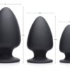 Three black silicone butt plugs of varying sizes