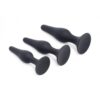Three black silicone anal plugs of different sizes