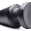 A black conical object with a rounded top