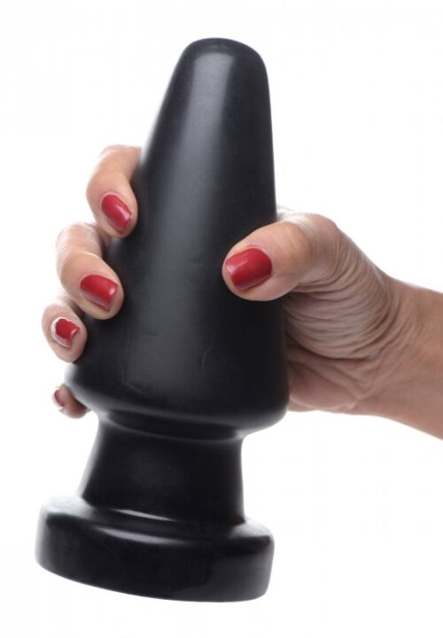 A hand with red nails holding a black silicone toy