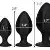 Three black silicone butt plugs in varying sizes