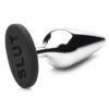 Metal anal plug with a black silicone base saying 'SLUT'