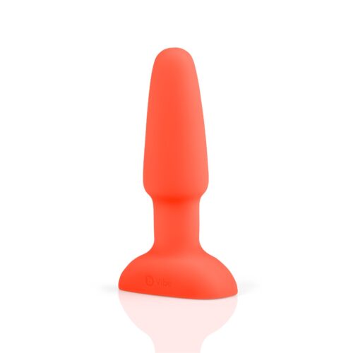 B-Vibe Rimming Vibrating Butt Plug in red, showcasing a smooth design