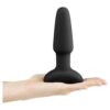 B-Vibe Rimming Vibrating Butt Plug held in a hand