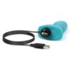 A turquoise vibrator with a USB charging cable