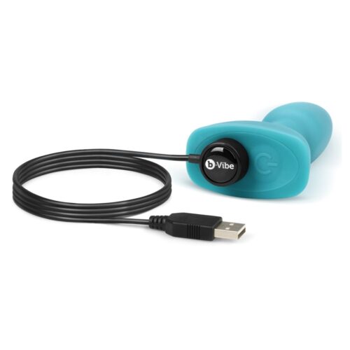 A turquoise vibrator with a USB charging cable
