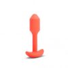 Vibrant orange silicone toy with a tapered design and base