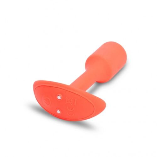 Vibrant orange silicone toy, featuring a rounded base and textured grip