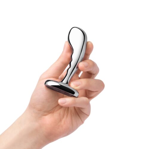 Hand holding a stainless steel P-spot training set