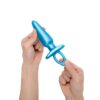 Sleek blue anal plug held in hand
