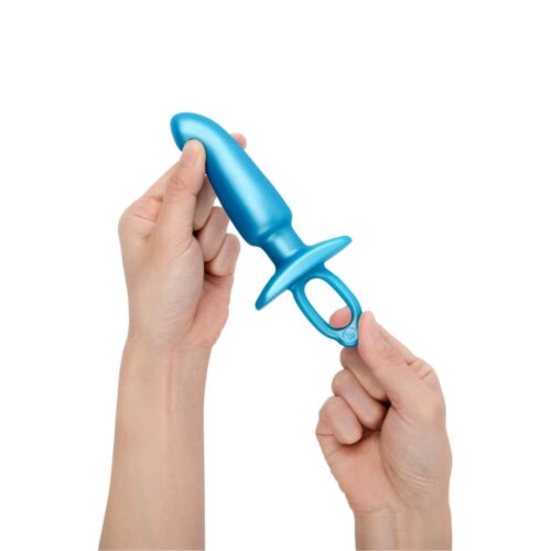 Blue silicone adult toy held by hands