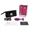 Discover Pleasure With The B-Vibe Vibrating Snug Plug, A Perfect Blend Of Comfort And Excitement. B-Vibe Vibrating Snug Plug In Purple, With Storage Bag, Charging Cable, And Manuals, Available At The Loving Company.
