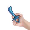 A blue and purple toy held in a hand