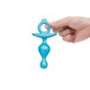 Blue silicone adult toy held by a hand