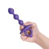 Purple silicone anal toy held in a hand