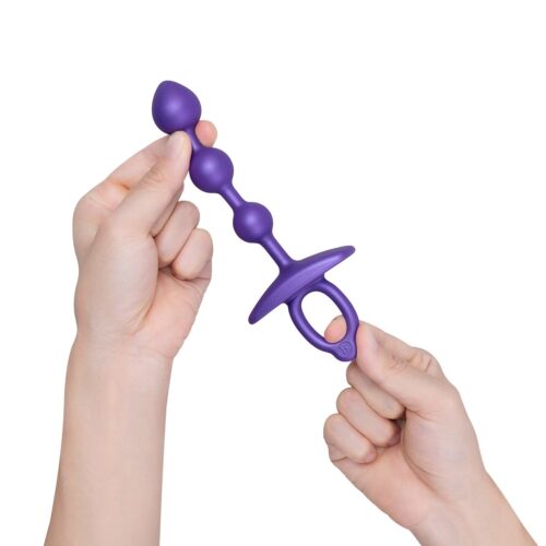 Purple silicone anal toy held in hands