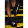 Feet in black socks with 'DADDY' print and paw print
