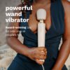 Le Wand Powerful Plug In Vibrating Wand Massager held by a person
