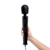 Le Wand Powerful Plug In Vibrating Wand Massager held in hand
