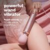 Le Wand Powerful Plug In Vibrating Wand Massager, resting on a person's thigh