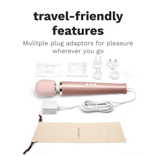 Le Wand Powerful Plug In Vibrating Wand Massager with pink head, charger, plug adaptors, and carrying pouch available at T...