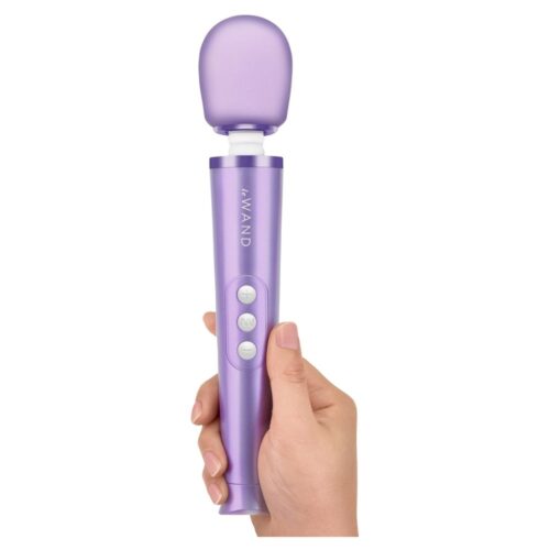 Le Wand Petite Rechargeable Wand Vibrator Massager in purple, held in a hand