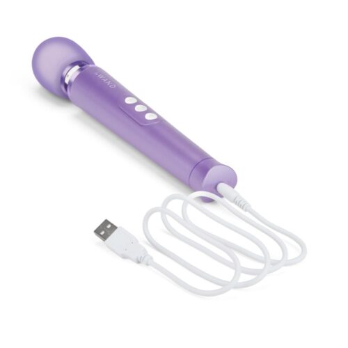 Le Wand Petite Rechargeable Wand Vibrator in purple, with three buttons and a USB charging cable, available at The Loving ...