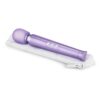 Le Wand Petite Rechargeable Wand Vibrator Massager in purple, next to a white zip case