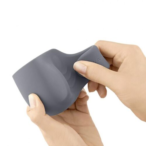 Le Wand Loop Wand Vibrator Penis Play Attachment in grey, held in a hand