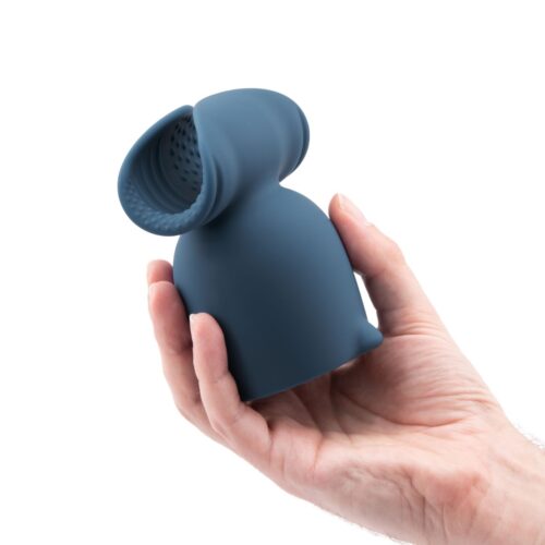 Le Wand Stroke Wand Vibrator Silicone Penis Play Attachment, held in a hand