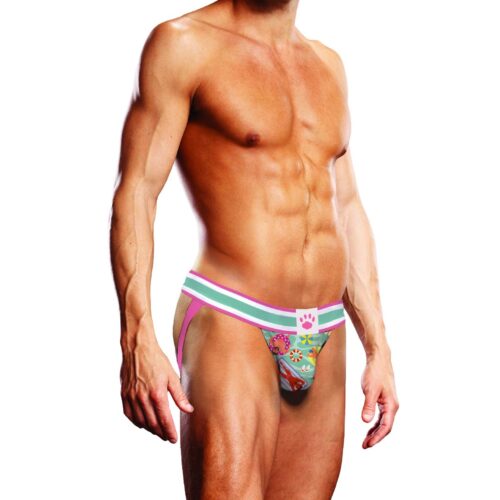 Show Off Your Fun Side With This Vibrant Swim Thong, Perfect For Summer Adventures. A Muscular Man In A Colorful Swim Thong With A Pink Waistband, Available At The Loving Company.