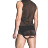 Model wearing a sheer black tank top and minimal underwear