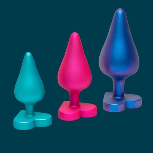 Three silicone toys in teal, pink, and blue