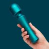 Romp Presto Wand Vibrator in green, held in a hand