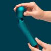 Romp Presto Wand Vibrator in green held by a hand