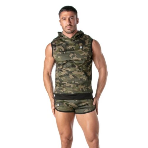 Muscular man in camouflage sleeveless hoodie and shorts