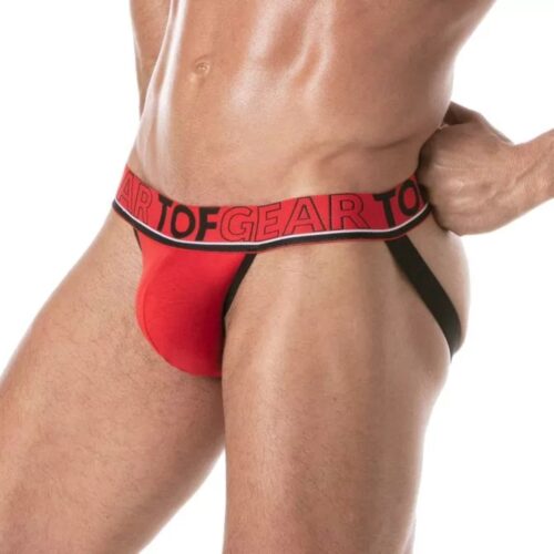 Model in red thong underwear with black waistband