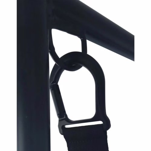 Close-up of a black carabiner attached to a strap on a metal frame