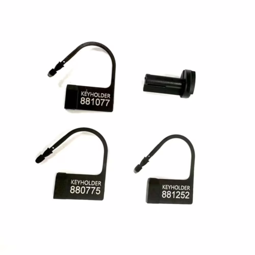 Explore secure options with the Cellmate Guardian Chastity Cage keyholders. Four black keyholders with numbers, designed for the Cellmate Guardian Chastity Cage