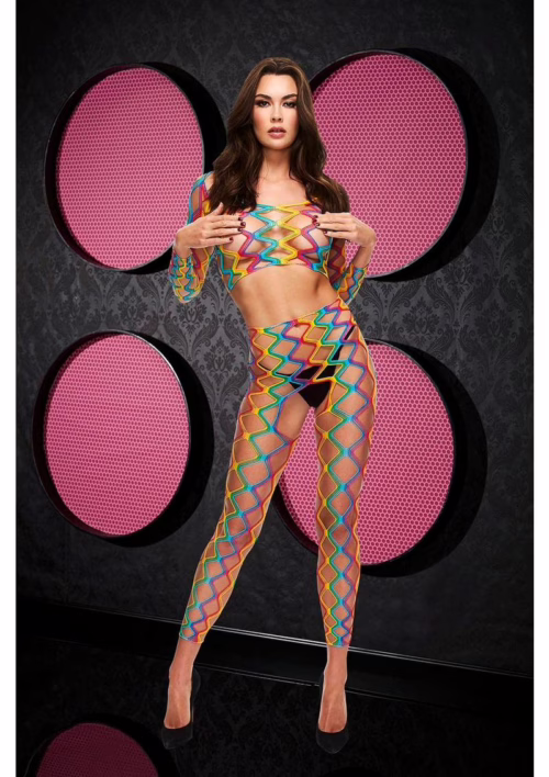 A model showcases a rainbow crop top and pants set with zigzag patterns