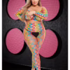 Model wearing a rainbow crop top and pants set, with a zigzag design and high heels