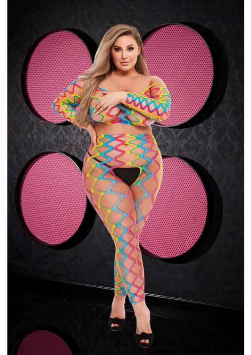 Model wearing a rainbow crop top and pants set, with a zigzag design and high heels
