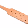 A tan wooden paddle with multiple holes