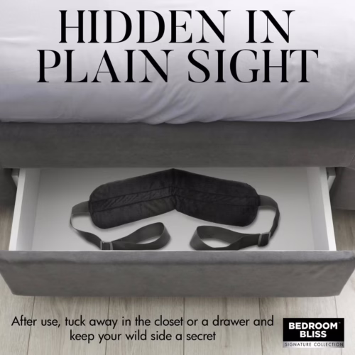 A black sleep maskis tucked in a drawer beneath a bed